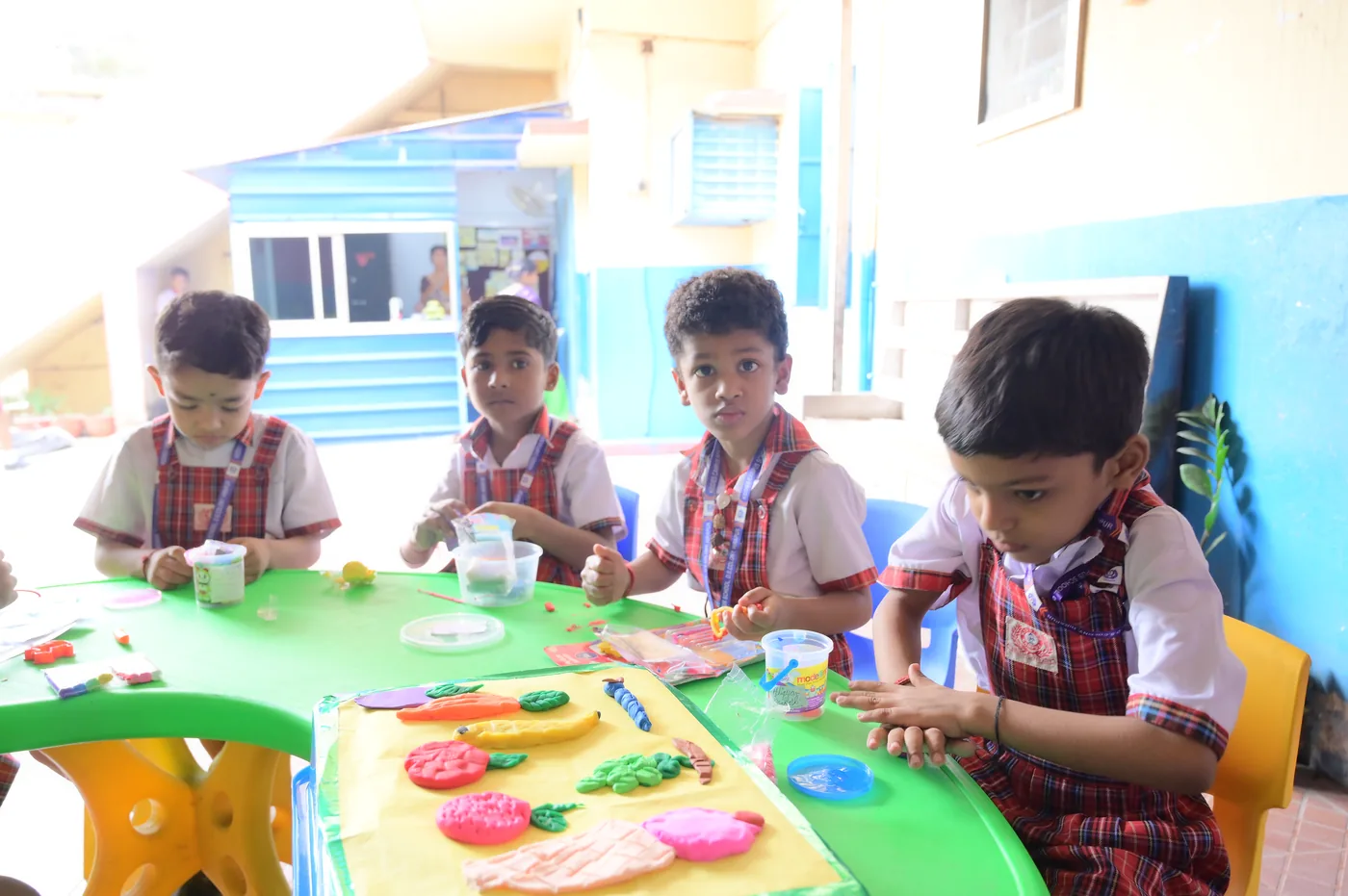 Children working with colours and craft at an activity table